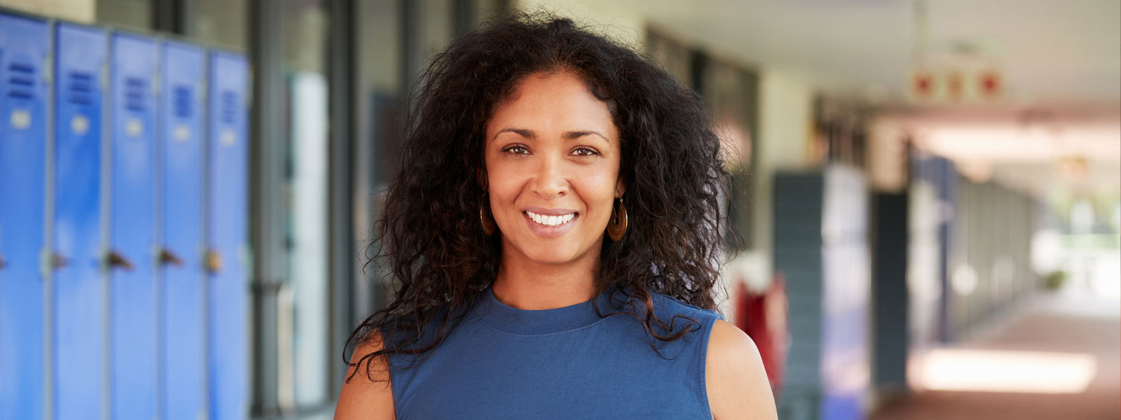 an educator in a blue dress