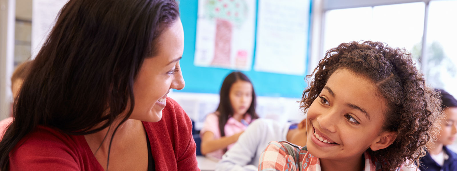 an educator teaching a young student